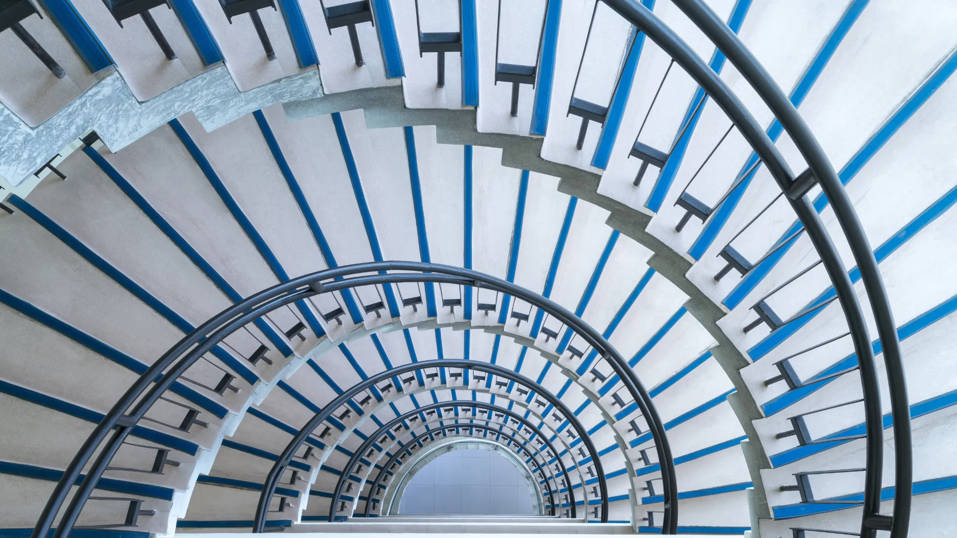 Spiral staircase symbolizing Yitro Global’s structured growth, cumulative experience, and continuous improvement in delivering enterprise solutions.