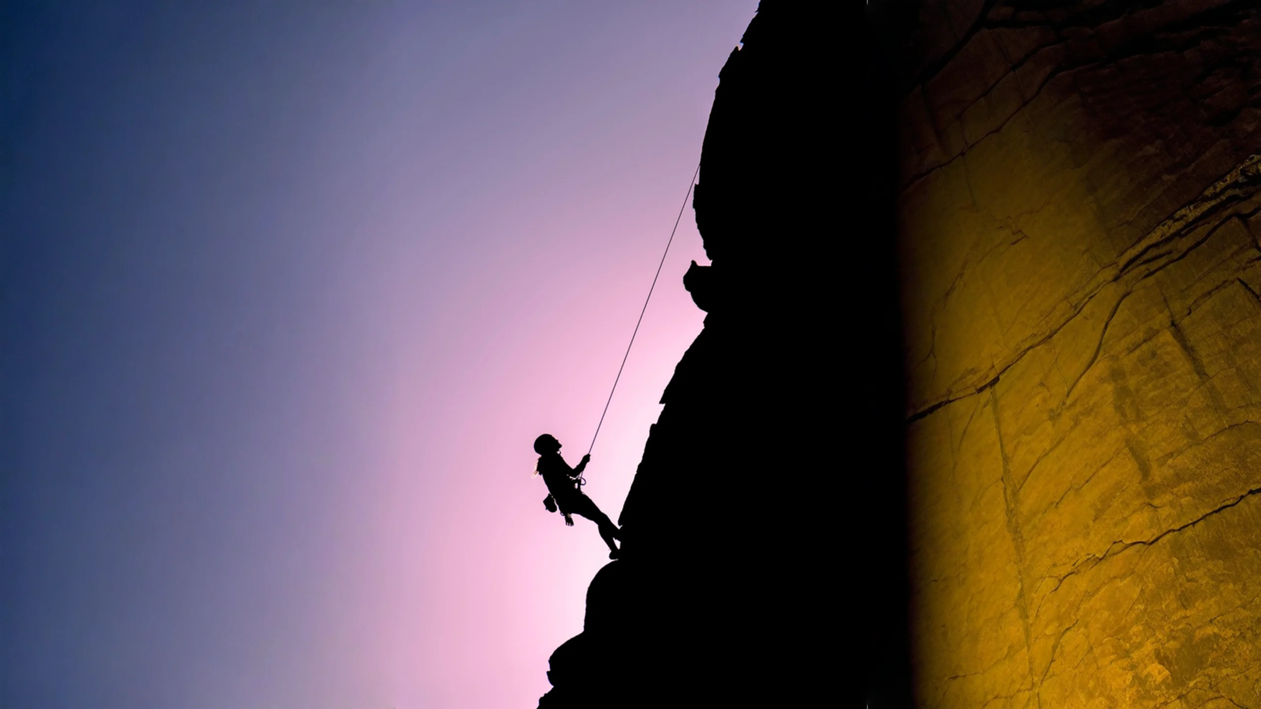 RCM outsourcing represented by a support rope system on a mountain, symbolizing guided operations, risk reduction, and specialized support